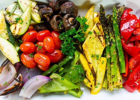 Vegetable platter with a bowl of creamy white dip